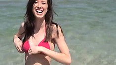 Gorgeous Brunette Teen In A Red Bikini Heads To Chill At The Beach