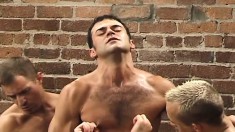 Muscled stud gets his ass penetrated by fists and dildos in a gay threesome in an alley
